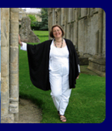 a pic of karen rae wilson leaning against a sacred pillar